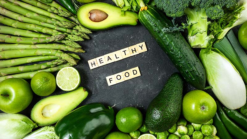 Close-up of varieties of green healthy vegetables and fruits.