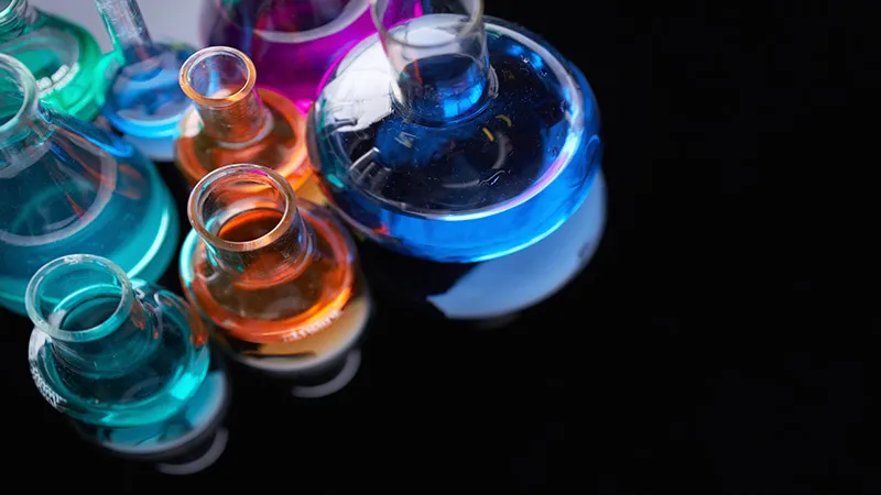 A set of flasks containing colourful chemicals