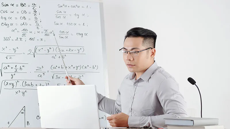 A teacher teaching maths in the classroom 