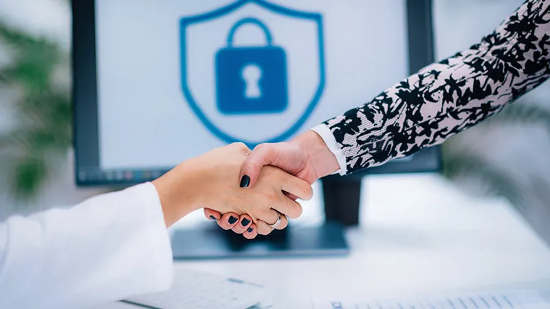 Handshake after signing medical data form in hospital