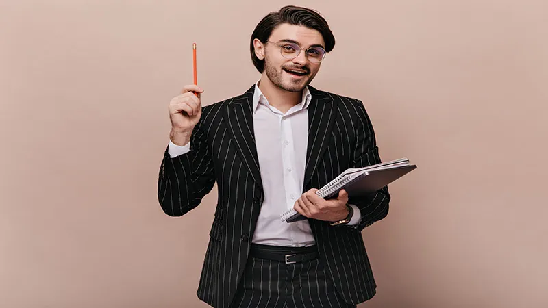 Elegant young teacher holds writing pen and gives lecture