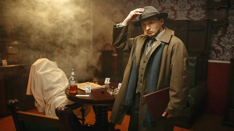 A detective in coat and hat in crime scene