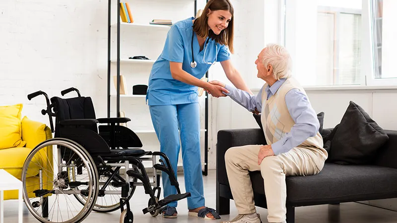 A nurse helping elderly 