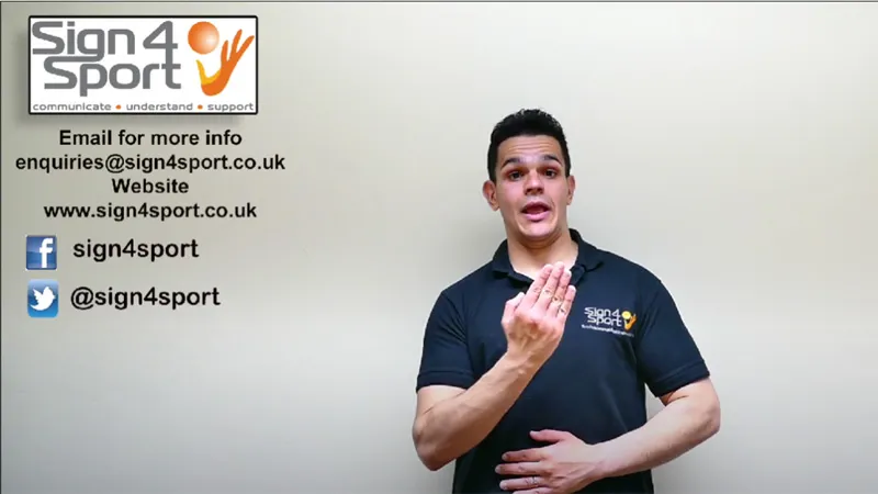 British Sign Language teacher with one hand near his chin