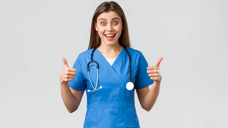 A nurse with thumbs up
