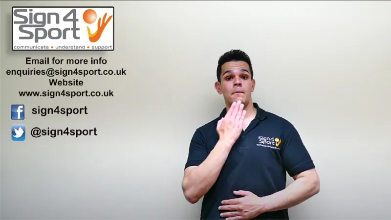 British Sign Language teacher with one hand touching his chin