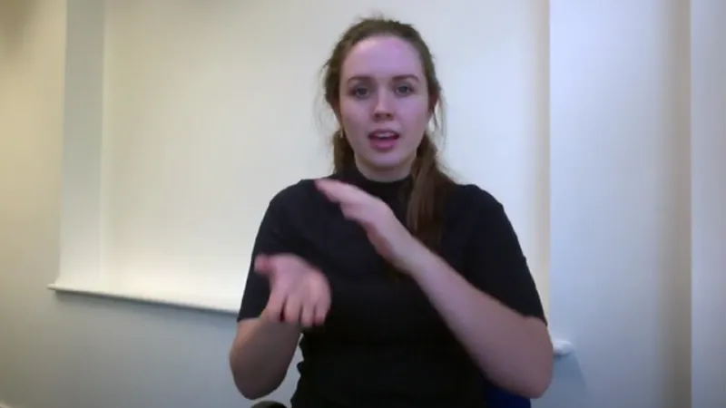 BSL tutor with hand gesture