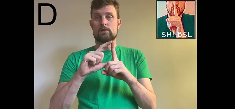 A Man Demonstrating How to Sign the Letter D