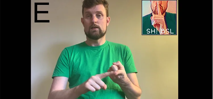 A Man Demonstrating How to Sign the Letter E