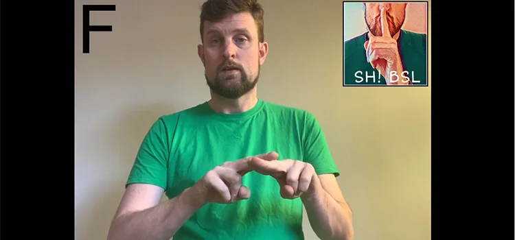 A Man Showing How to Sign the Letter F