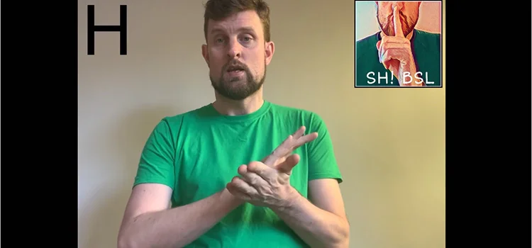 A Man Demonstrating How to Sign the Letter H