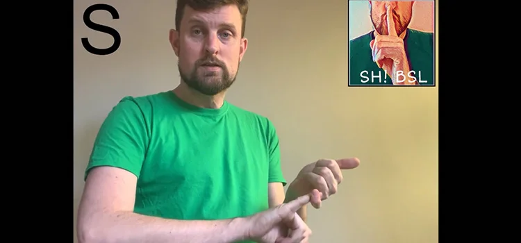 A Man Demonstrating How to Sign the Letter S