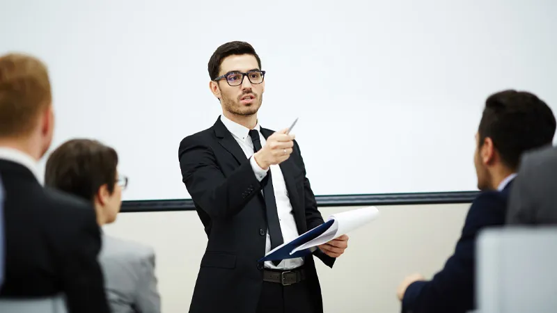 A teacher taking a question in a classroom