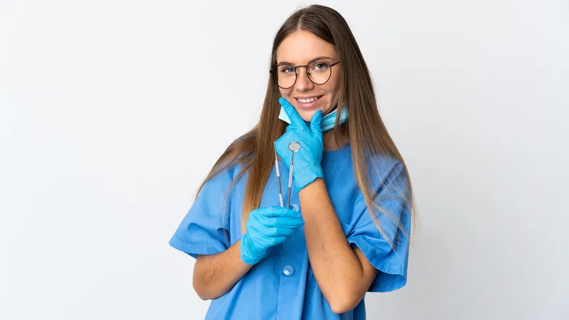 Young female dentist smiling
