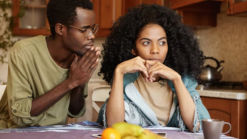 Boyfriend asking for forgiveness from upset girlfriend