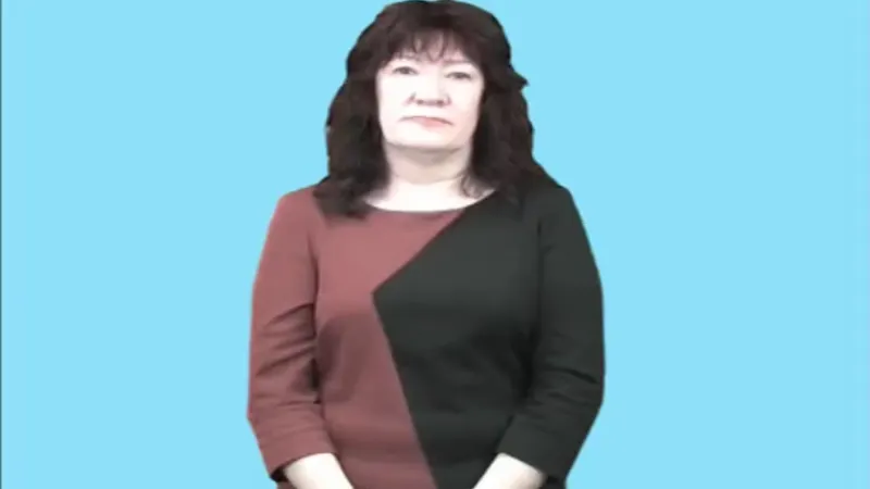 Female tutor is sitting in a room with a light blue background and a normal posture