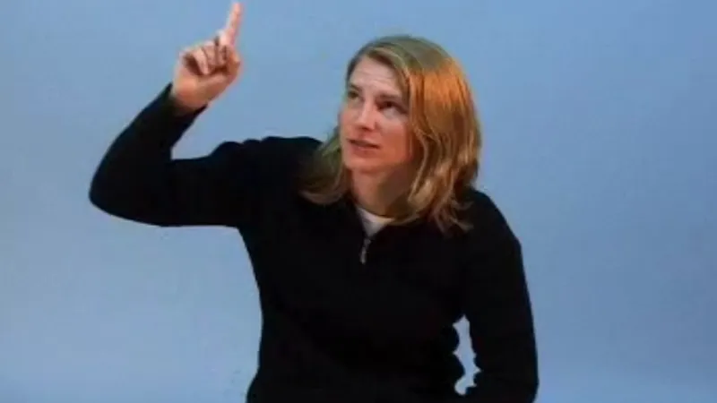 BSL interpreter signing God in British sign language