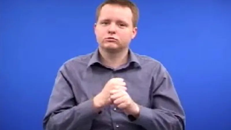 BSL interpreter with one fist above the other