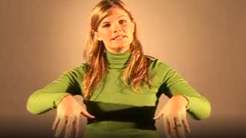 Woman shows how to sign “Tree” in British Sign Language with hand posture