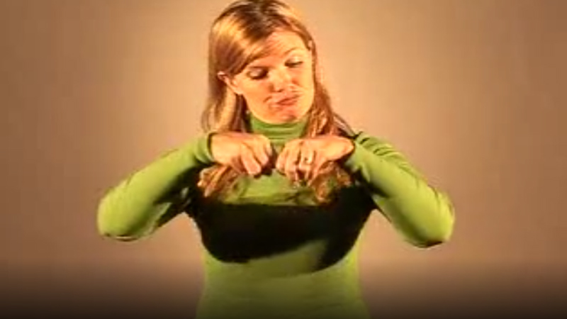 Woman shows how to sign “Tree” in British Sign Language with hand posture