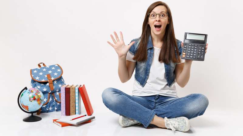 A girls holding a calculator