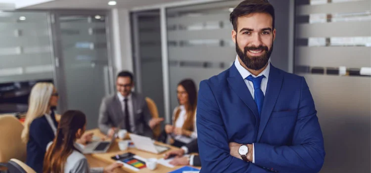 A Smiling Business Intelligence Manager Standing in Meeting Room