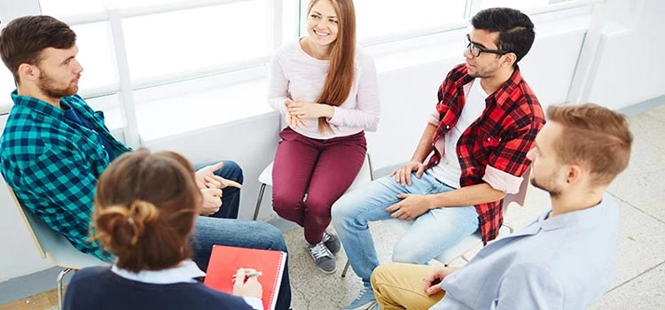Counsellor in a group counselling session