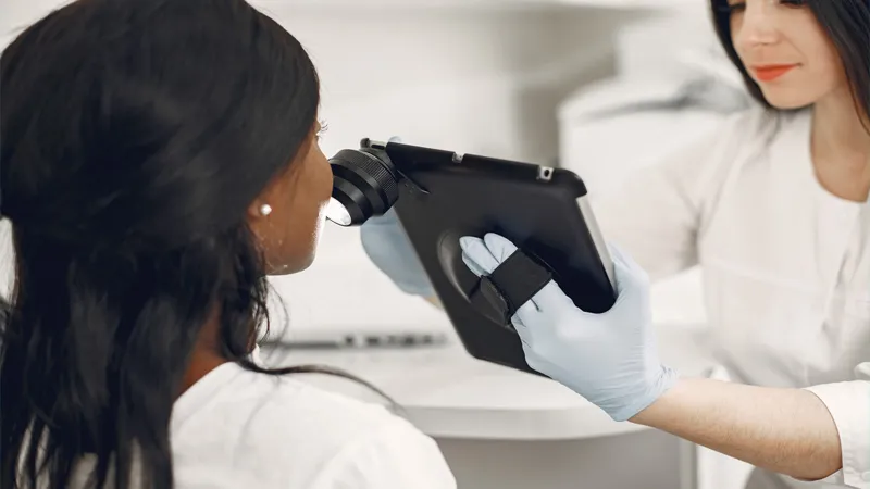 Dermatologist checking skin of her patient