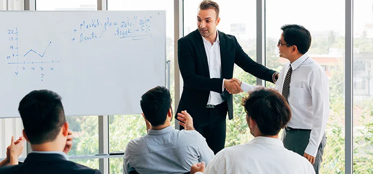  The manager Presents Business Strategy with Charts and Discusses Financial Analysis with Coworkers