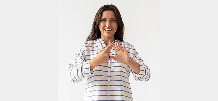 Portrait of woman teaching sign language.