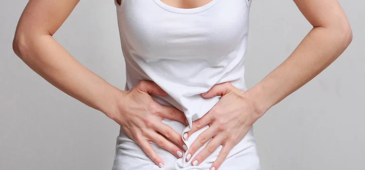 Woman with stomachache, having food poisoning or menstrual period cramp