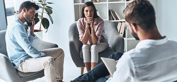 Couple on a discussion session with the therapist