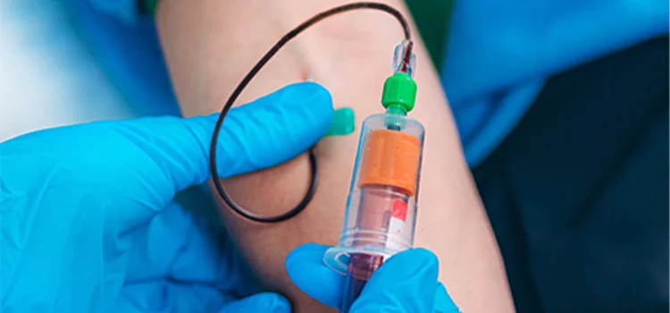 A nurse taking blood sample for routine blood test