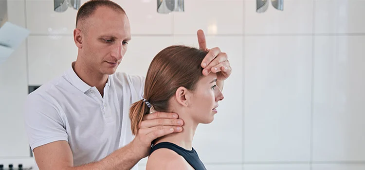 Doctor fixing the posture of his patient