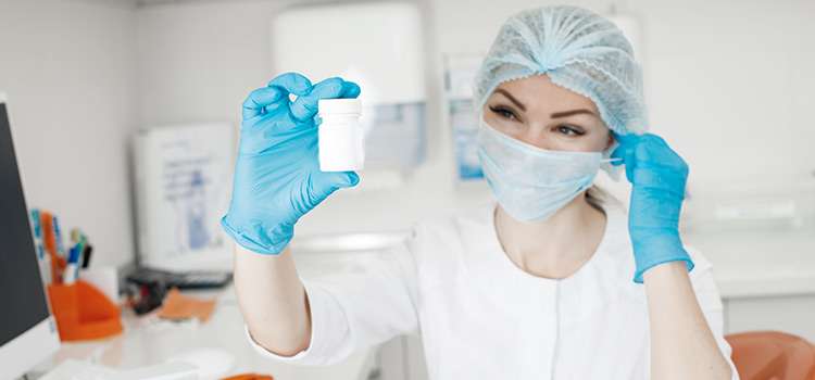 A Female Medical Laboratory Assistant Working with Sample