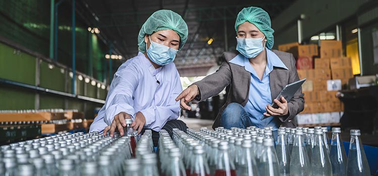 Two environmental health officers performing quality check