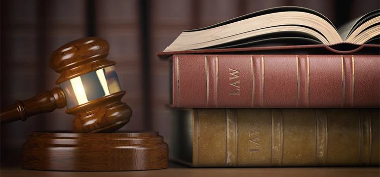 A concept of law and justice through the image of gavel and law books.