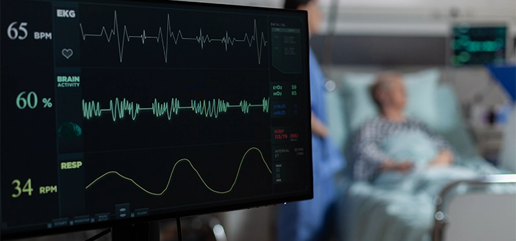 A monitor showing live ECG results along with brain activity and RPM. 