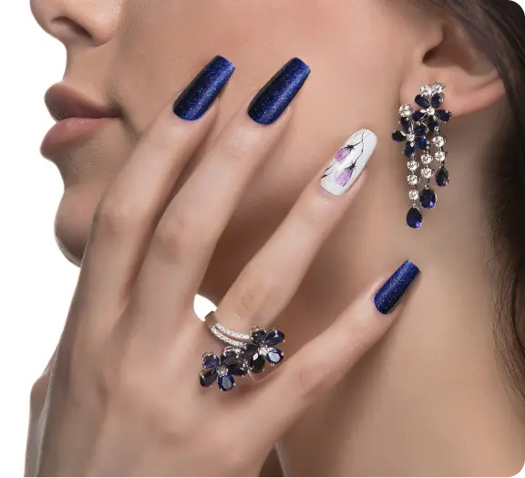 woman-with-nail-art-promoting-design-luxury-earrings-ring